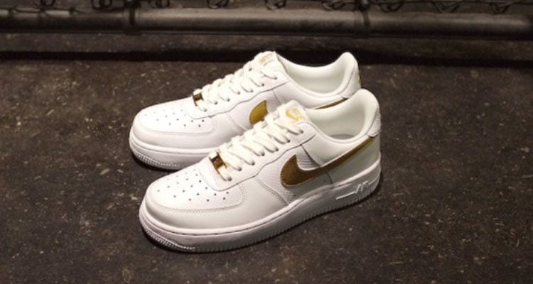 gold and white air force ones