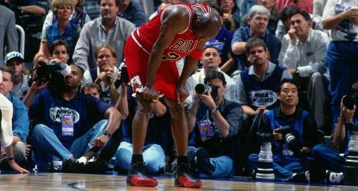 Michael Jordan wearing the The Shoe Surgeon Creates Bespoke COMME des GARÇONS x Air Jordan 12 in the Flu Game