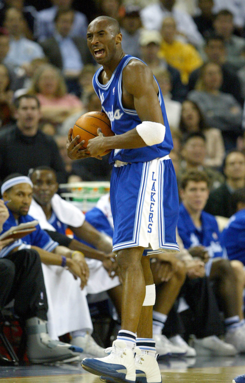 kobe bryant wearing blue lakers jersey