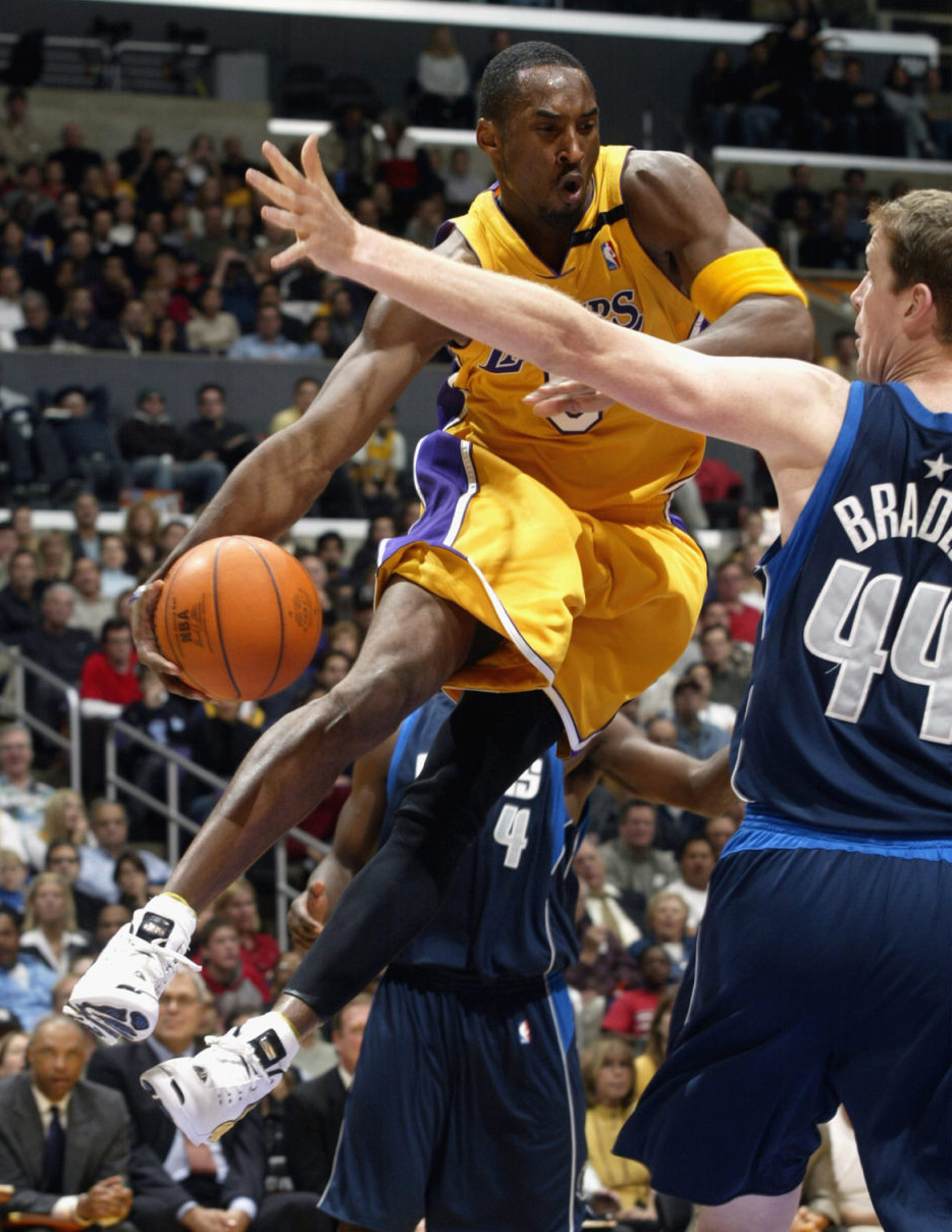 Kobe Bryant wearing number 8 jersey and Air Jordan Retro VIII PE shoes