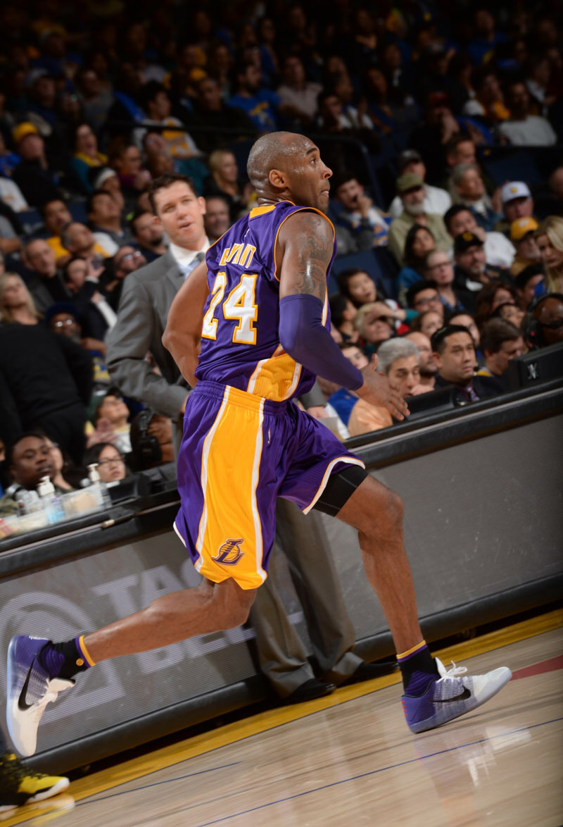 Kobe Bryant wearing the Moschino logo-print knee-length boots Schwarz