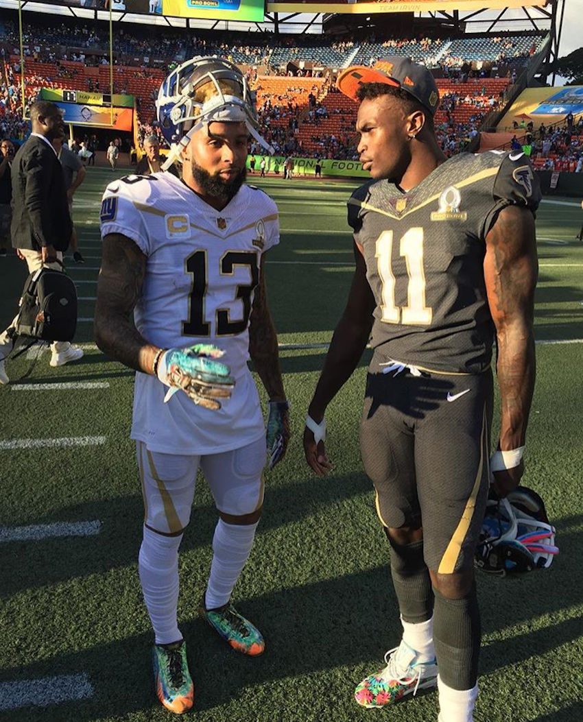New York Giants' Odell Beckham Jr. in a Custom Makeup of the Nike Vapor Carbon 2014 and Atlanta Falcons' Julio Jones in a Pro Bowl PE of the Under Armour Mercenary