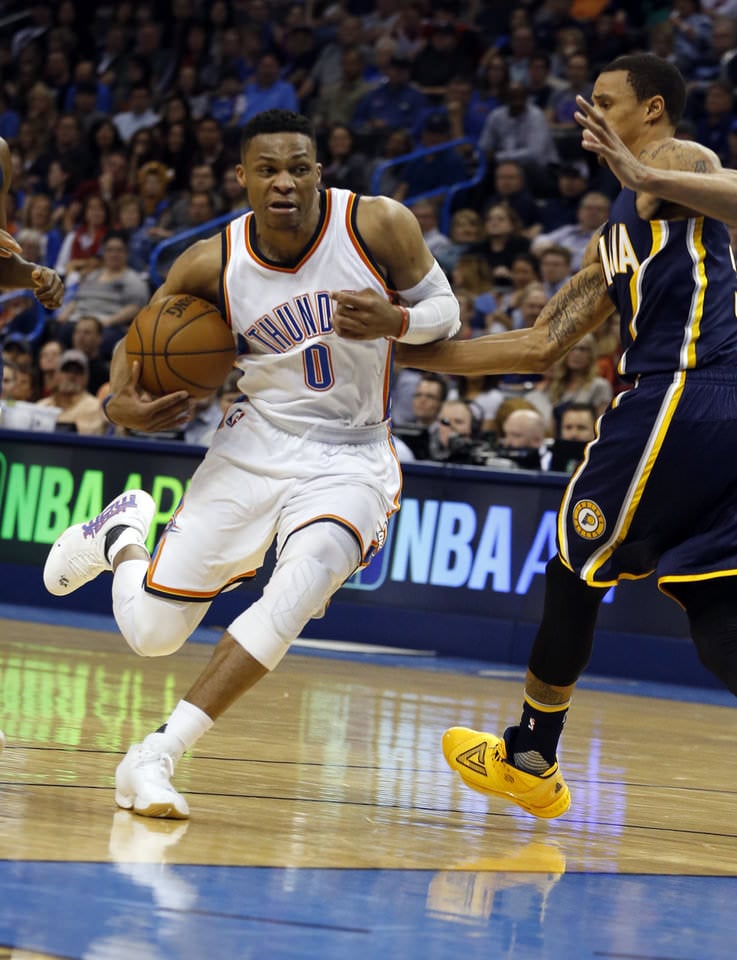 Oklahoma City Thunder's Russell Westbrook (0) drives past Indiana's George Hill (3) in the second half of an NBA basketball game where the Oklahoma City Thunder lost to the Indiana Pacers 101-98 at the Chesapeake Energy Arena in Oklahoma City, on Feb. 19, 2016. Photo by Steve Sisney The Oklahoman