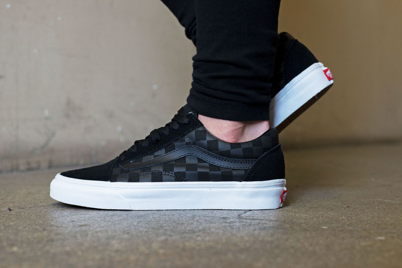 all black old skool vans on feet