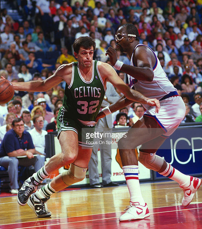 LANDOVER, MD - CIRCA 1987: Kevin McHale #32 of the Boston Celtics drives on Moses Malone #4 of the Washington Bullets during an NBA basketball game circa 1987 at the Capital Center in Landover, Maryland. McHale played for the Celtics from 1980-94. (Photo by Focus on Sport/Getty Images) *** Local Caption *** Kevin McHale; Moses Malone