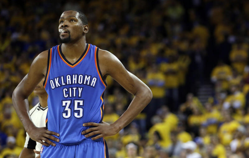 FILE - In this May 26, 2016, file photo, Oklahoma City Thunder's Kevin Durant watches during the closing minutes of the second half in Game 5 of the NBA basketball Western Conference finals against the Golden State Warriors in Oakland, Calif. Durant may not be ready to talk about his free agency yet, but it's one of the biggest issues facing the Oklahoma City Thunder after losing in seven games of the Western Conference finals to Golden State. (AP Photo/Marcio Jose Sanchez, File)
