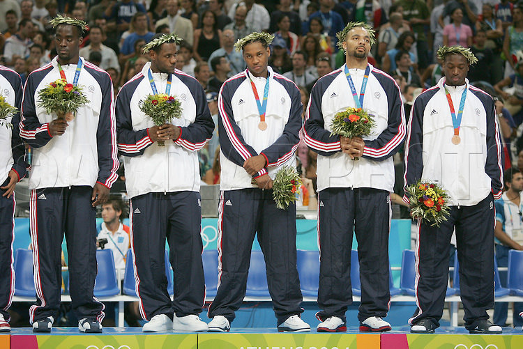 8/28/04 --Al Diaz/Miami Herald/KRT--Athens, Greece--Lituania vs USA during the Athens 2004 Olympic Games at Olympic Indoor Hall. USA wins the Bronze Medal defeating LTU 96-104. USA's Left to right, Emeka Okafor, Lebron James, Carmelo Anthony, Carlos Boozer and Dwyane Wade disappointed in only winning the Bronze Medal.