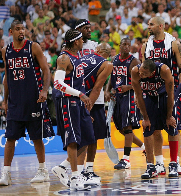 ATHENS - AUGUST 27: USA stands on the court dejected after their loss to Argentina during the mens' basketball semifinal game on August 27, 2004 during the Athens 2004 Summer Olympic Games at the Indoor Hall of the Olympic Sports Complex in Athens, Greece. NOTE TO USER: User expressly acknowledges and agrees that, by downloading and or using this photograph, User is consenting to the terms and conditions of the Getty Images License Agreement. Mandatory copyright notice: Copyright NBAE 2004 (Photo by Jesse D. Garrabrant/NBAE via Getty Images) *** Local Caption *** Tim Duncan;Allen Iverson;Stephon Marbury;LeBron James