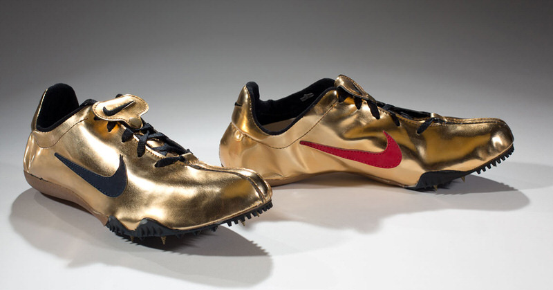 gold nike spikes