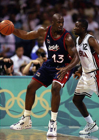 22 Jul 1996: Center Shaquille O''Neal of the Dream Team backs into the post while being guarded by David Dias of Angola during the USA v Angola basketball game at Georgia Dome at the 1996 Centennial Olympic Games in Atlanta, Georgia.