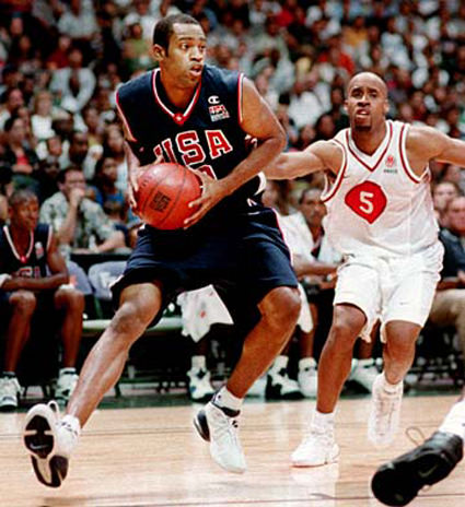 20000831 SPT - USA Olympic player Vince Carter looks for an open man as Canadian player Sherman Hamilton trails behind in a game on Thursday night. SB photo by George F. Lee