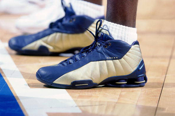 SYDNEY - SEPTEMBER 30: Vince Carter of the United States National Team shows off his sneakers against the French National team during the 2000 Summer Olympics played September 30, 2000 in Sydney, Australia. NOTE TO USER: User expressly acknowledges that, by downloading and or using this photograph, User is consenting to the terms and conditions of the Getty Images License agreement. Mandatory Copyright Notice: Copyright 2000 NBAE (Photo by Nathaniel S. Butler/NBAE via Getty Images)