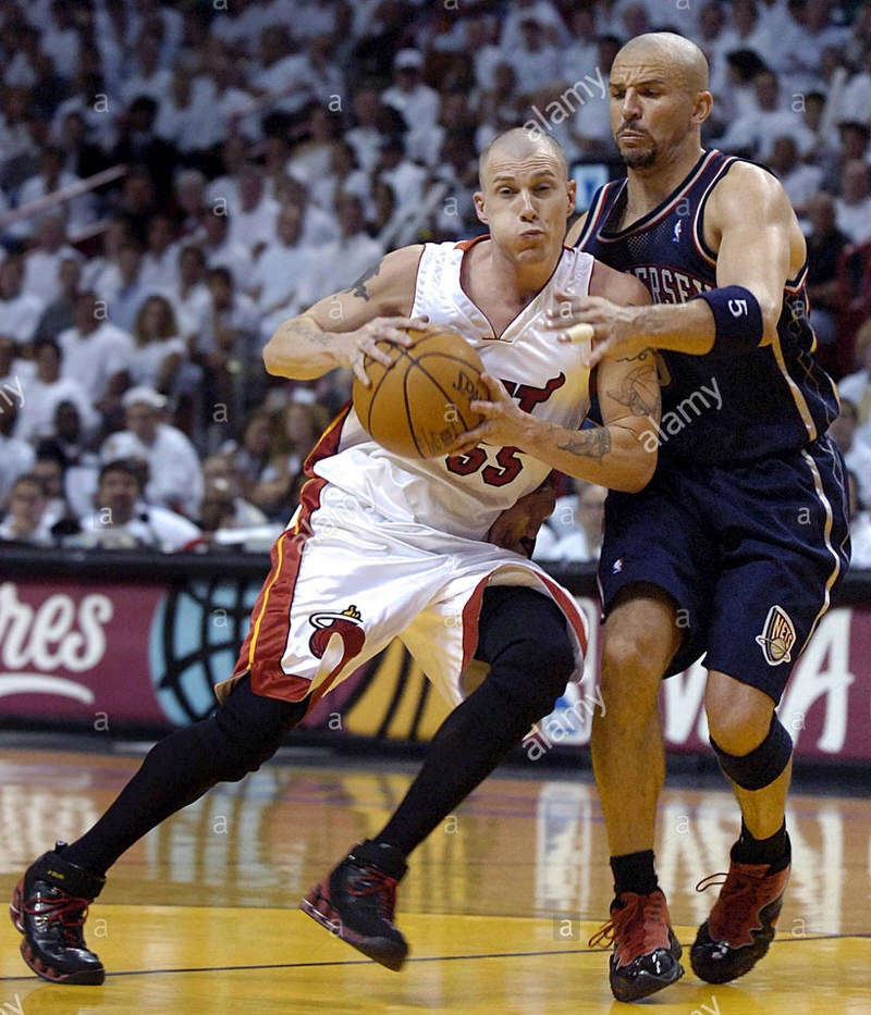 epa00708481 Miami Heat guard Jason Williams (L) is defended by New Jersey Nets guard Jason Kidd (R) during their second round Eastern Conference playoff game at the American Airlines Arena in Miami, Florida, Monday 08 May 2006 The Nets defeated the Heat 100-88 to take a one game to none lead in the best-of-seven series. . EPA/RHONA WISE