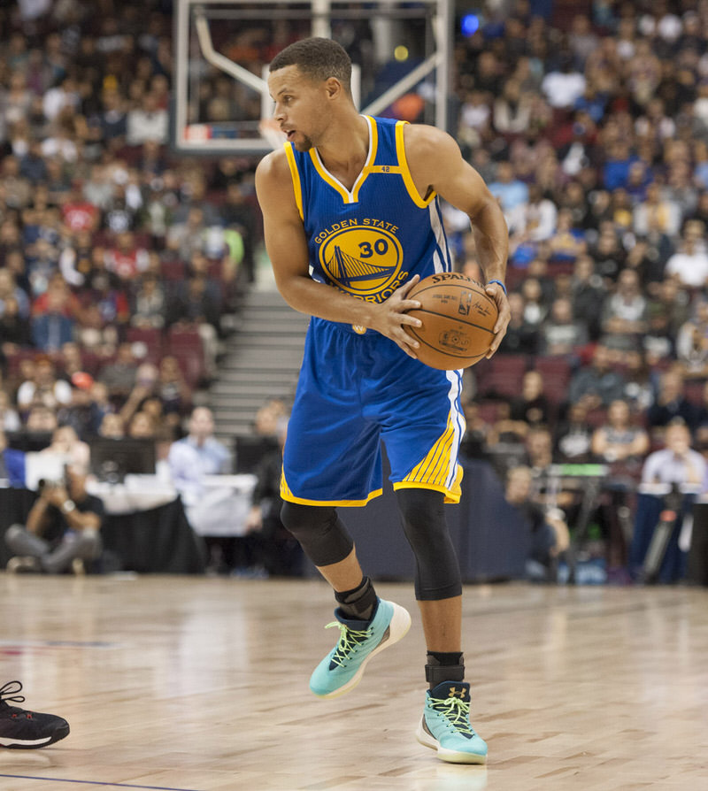 Oct 1, 2016; Vancouver, British Columbia, CAN; Toronto Raptors guard Kyle Lowry (7) defends against Golden State Warriors guard Stephen curry (30) in the first quarter at Rogers Arena. Mandatory Credit: Peter Llewellyn-USA TODAY Sports