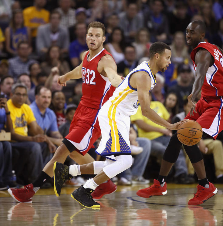 Stephen Curry in the Under Armour Curry 3 Black/Taxi Camo