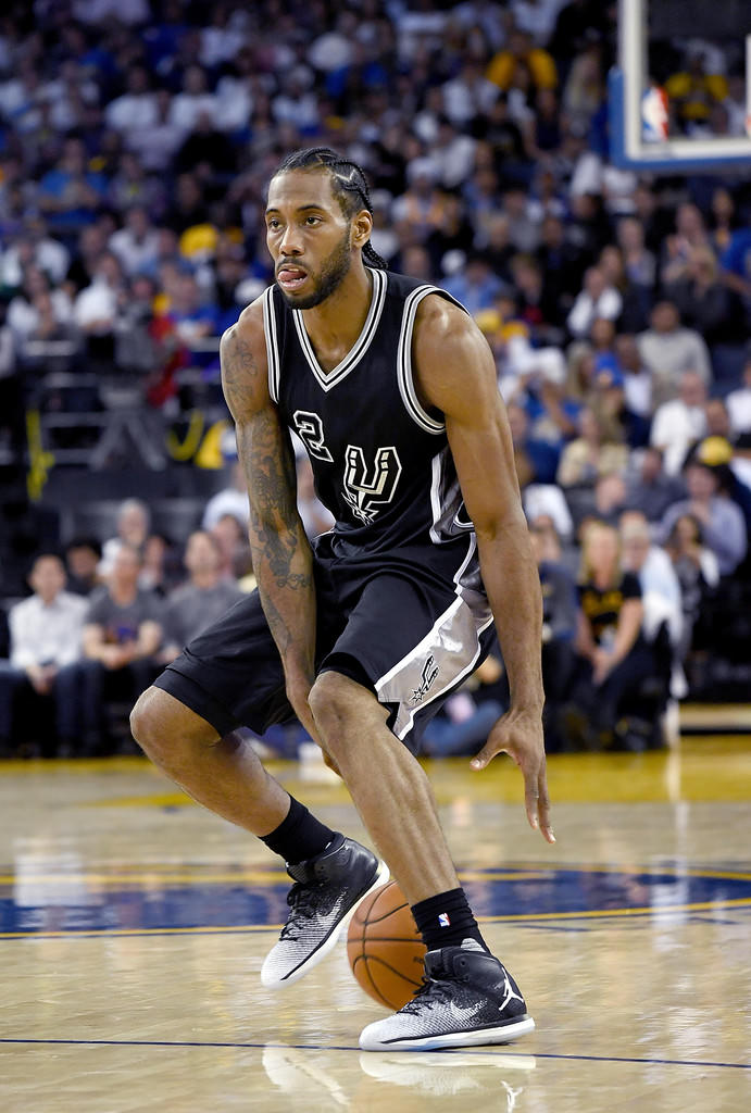 Kawhi Leonard dribbles in the Air Jordan XXX1 "Fine Print"