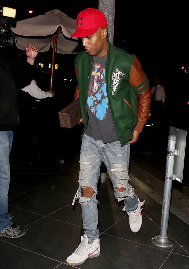 Kid Cudi in the Nike SB Dunk High Birch/Hyper Red