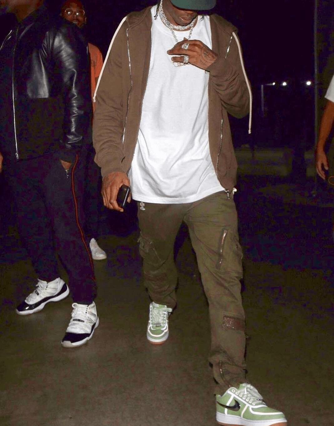 Travis Scott in a dyed pair of the Travis Scott x Nike Air Force 1 Low