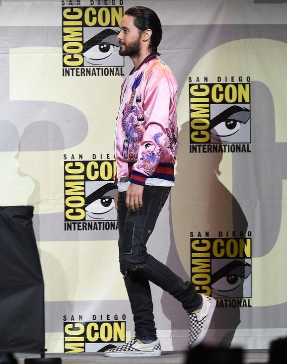 This background pretty much sums up Leto's typical style, but we're about that Gucci bomber and checkered Vans get-up.