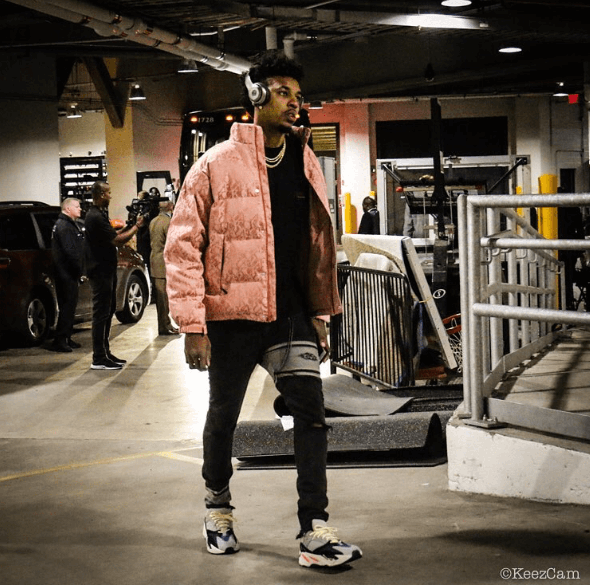 Swaggy P's pink jacket and Yeezy's add some contrast to his otherwise muted styling.