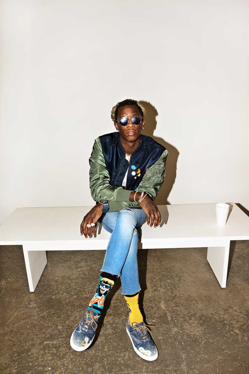 If Young Thug's keeping his wardrobe fairly neutral, he'll jazz it up with his wild sock rotation.