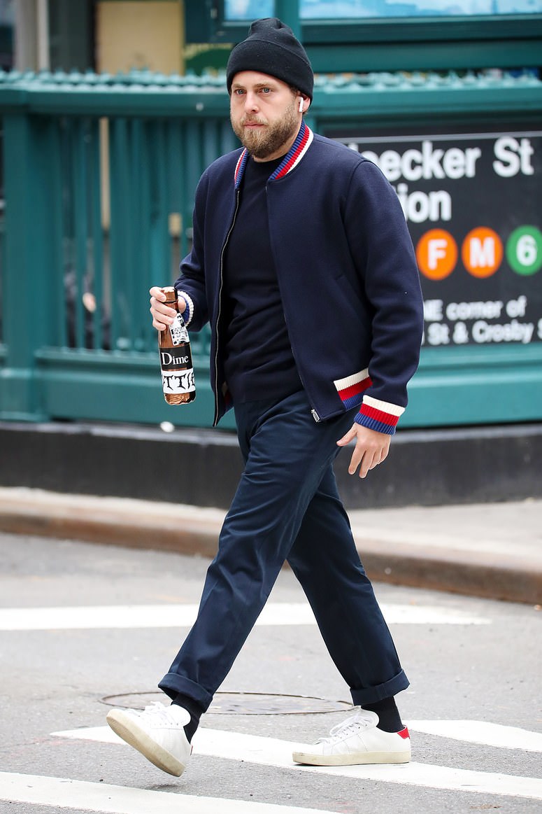 Jonah Hill's Gucci bomber and Saint Laurent SL/06 combination is an effective combo that blends designer with a skate punk edge.