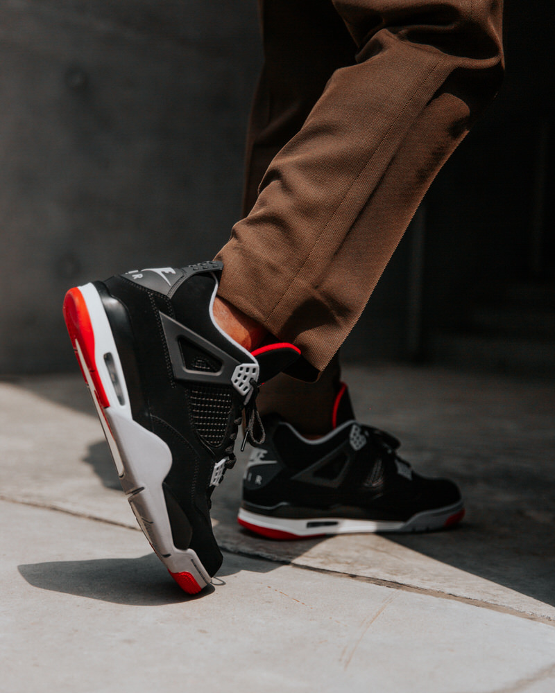 black & red jordan 4