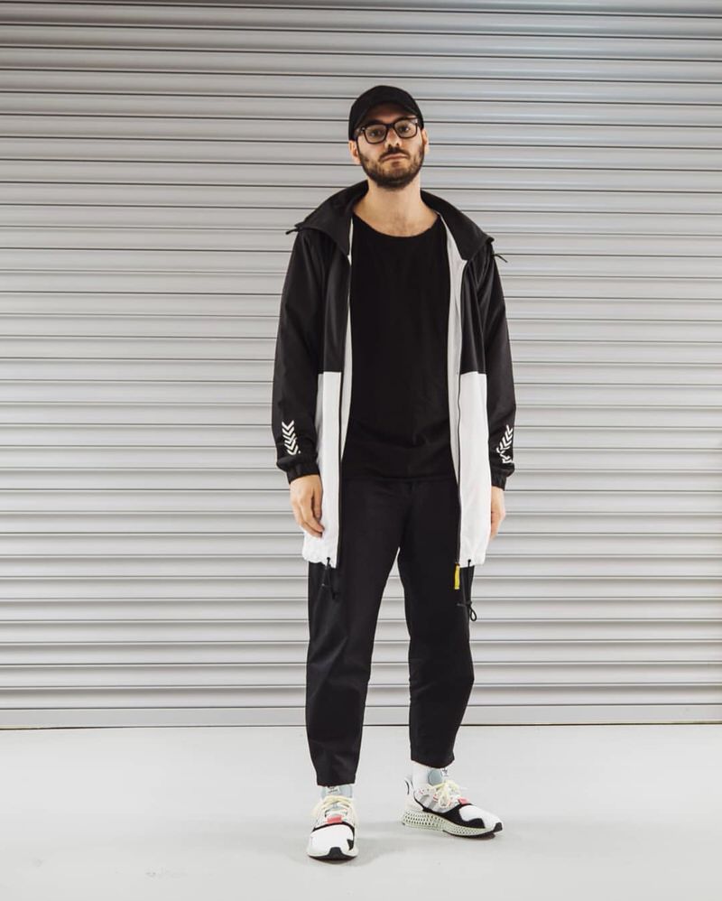 @ozakon keeps his wardrobe palette neutral and emphasizes the technical trend with a contemporary rain jacket and adidas 4D Futurecrafts.