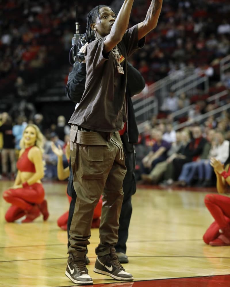 Travis Scott pairs neutral tones with cargo pants and the Easter SB Dunk Highs.