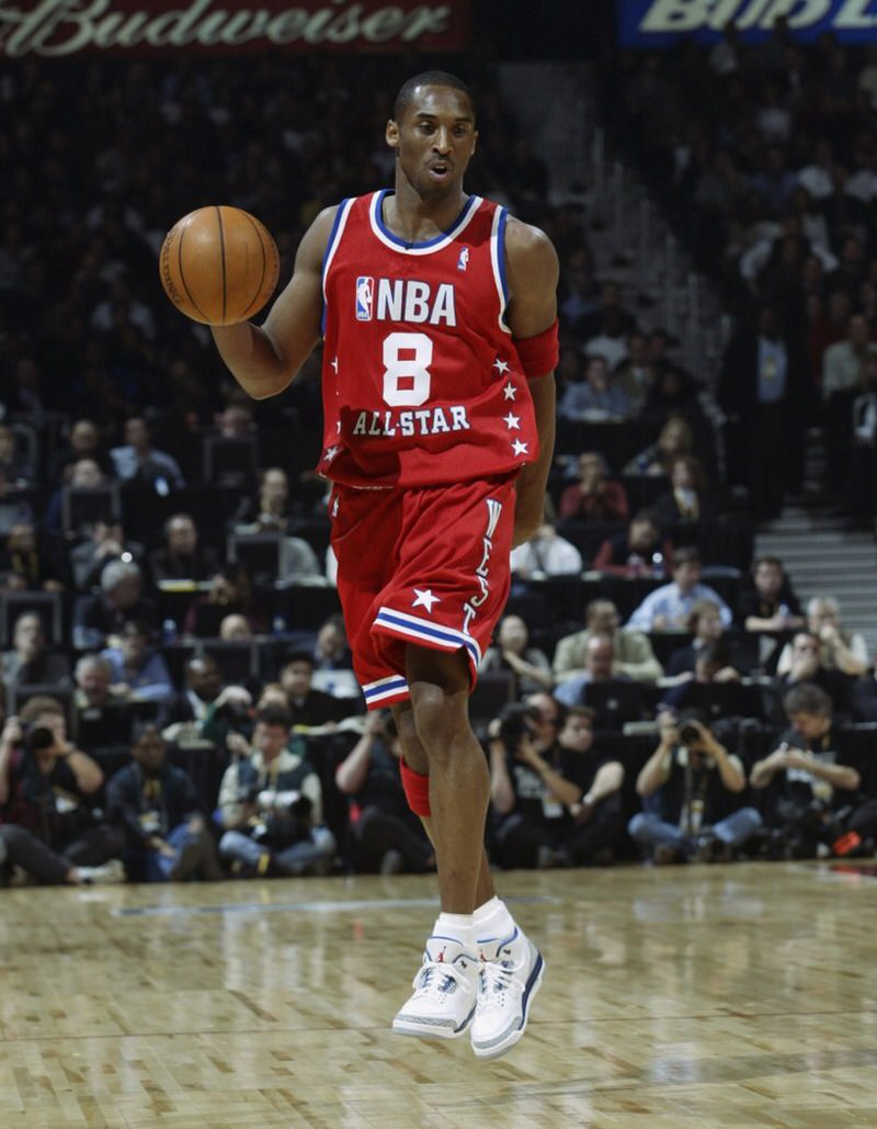 Kobe Bryant wearing number 8 jersey and Air Jordan Retro VIII PE shoes