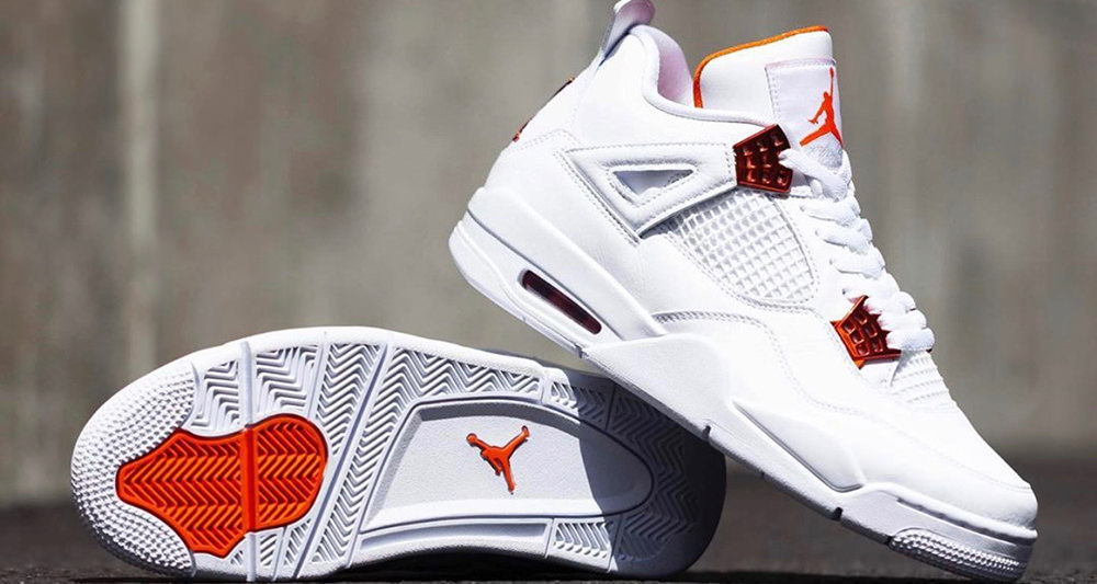 white and orange jordan 4