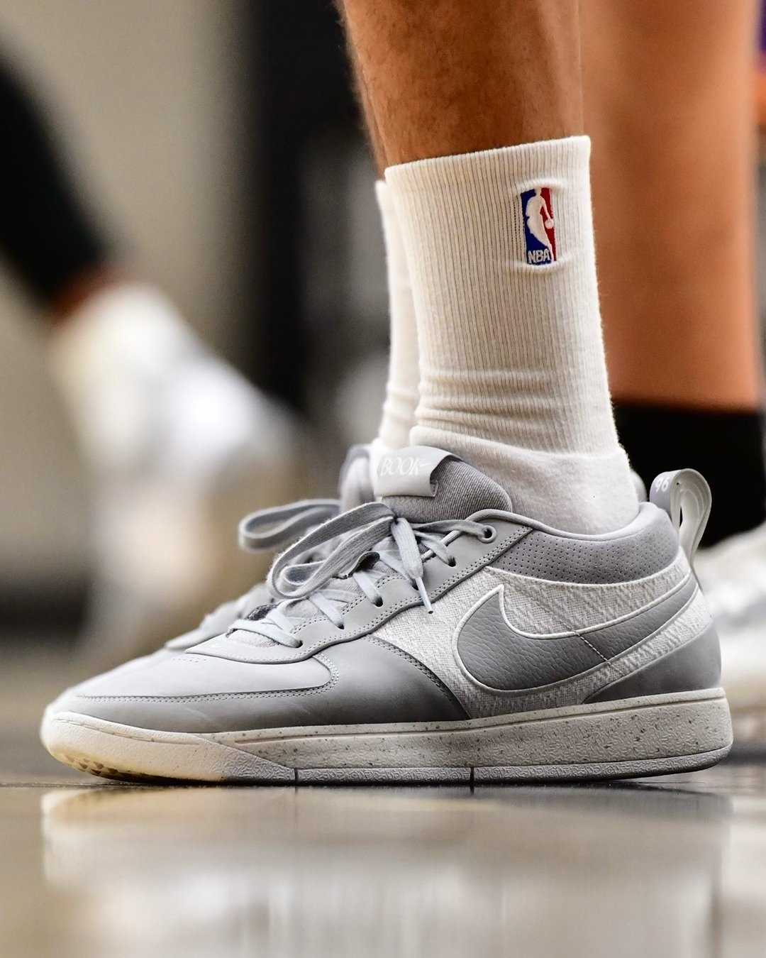 Devin Booker in the nike navy Book 1 "Cool Grey"