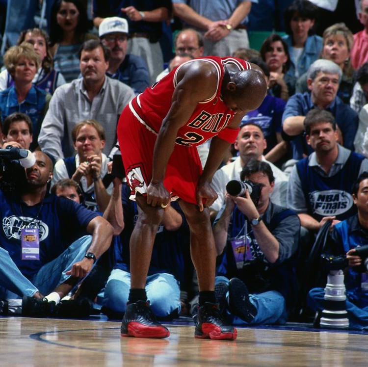 Michael Jordan wearing the Air Jordan 12 Black/Varsity Red aka "Flu Games"