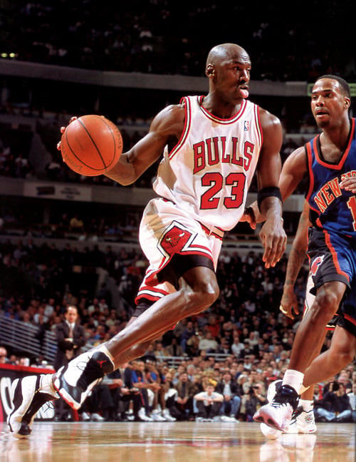 Michael Jordan wearing the Air Jordan 13 Black/White/Red