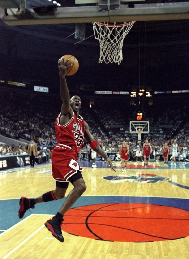 Michael Jordan wearing the Air Jordan 13 Black/Red aka Playoffs