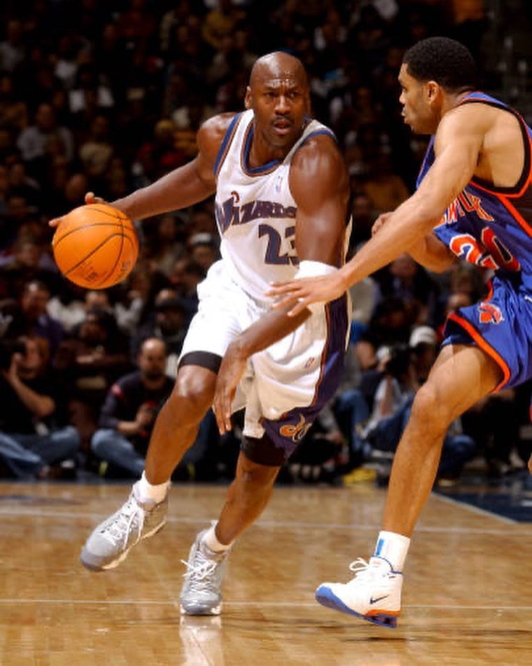 Michael Jordan wearing the Air Jordan 9 "Cool Grey" Retro while playing for the Washington Wizards