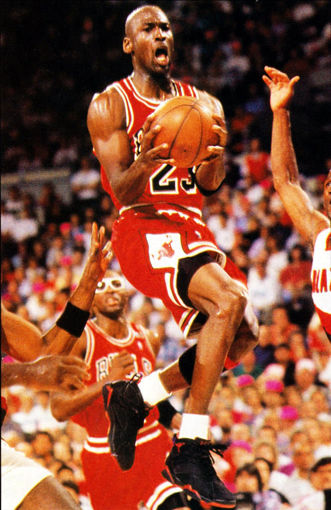 Michael Jordan wearing the Air Jordan 7 Black/Red