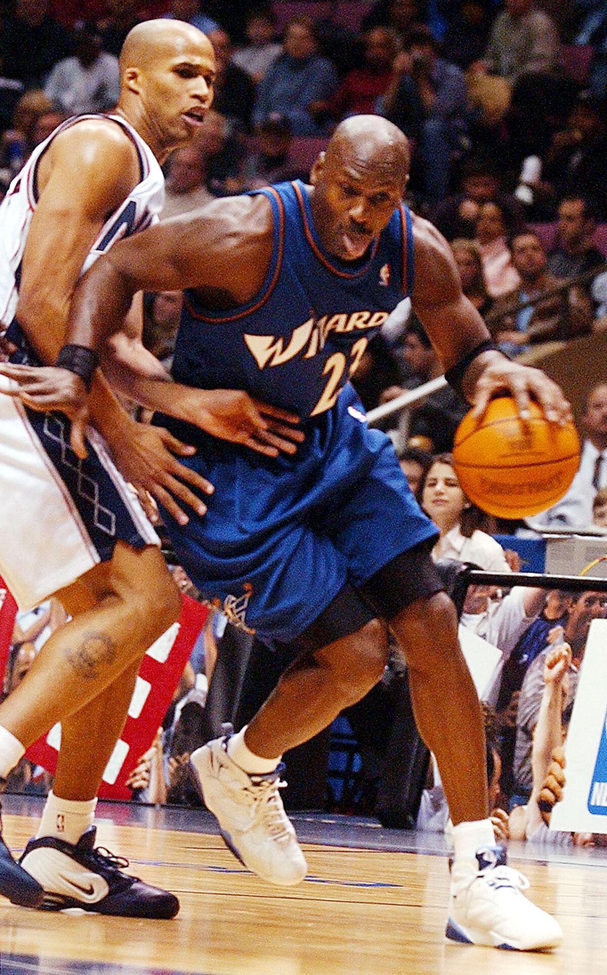 Michael Jordan wearing the Air Jordan 7 "French Blue" Retro playing for the Washington Wizards in 2002